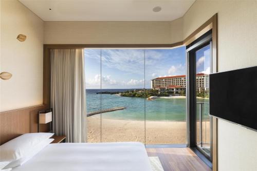 a hotel room with a view of the ocean at Hyatt Regency Seragaki Island Okinawa in Onna