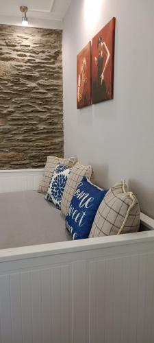 a bed with two pillows on top of it at My sweet home Andros in Andros