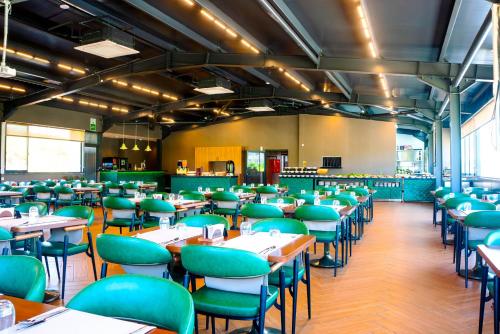 an empty dining room with tables and chairs at ivy Hotel Spa in Yalova