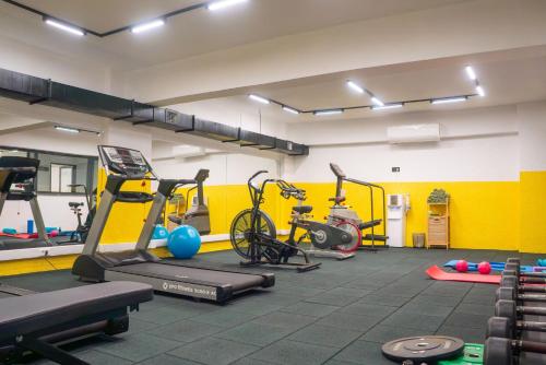 a gym with several treadmills and exercise bikes at ivy Hotel Spa in Yalova