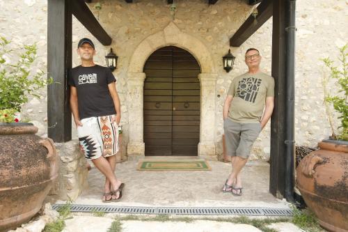 two men standing in front of a door at Casale La Quercia in Poggio Bustone