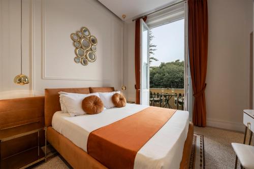 a hotel room with a bed with a large window at Villa Libertà in Palermo