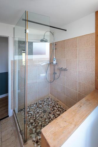 a bathroom with a shower with a glass door at Une escale à Malo in Dunkerque