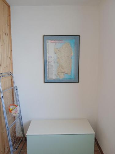 a picture of a map on a wall with a white freezer at I tramonti di Barbusi in Barbusi