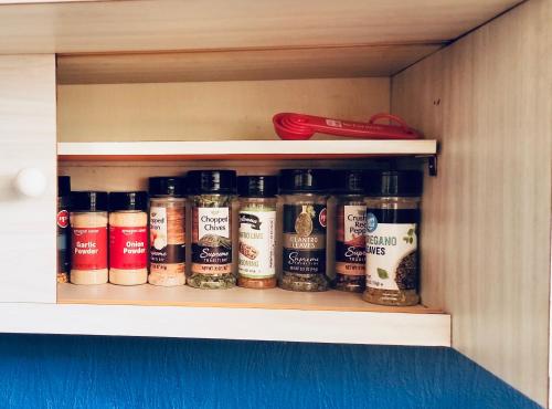 a cabinet filled with lots of different spices at The Mod Pod in Eugene