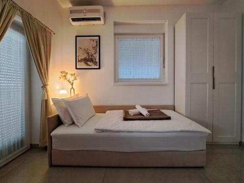 Katil atau katil-katil dalam bilik di Studio apartman Kali