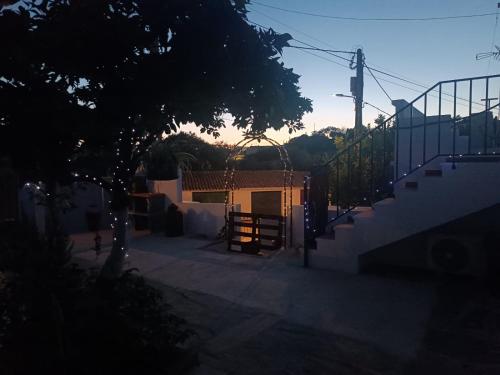 a set of stairs leading to a building with a gate at Casa Pito in Santo António do Baldio