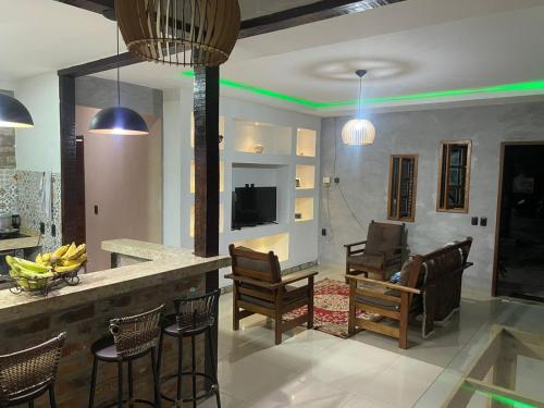 Μια τηλεόραση ή/και κέντρο ψυχαγωγίας στο Linda Casa nos Pequenos Lençóis