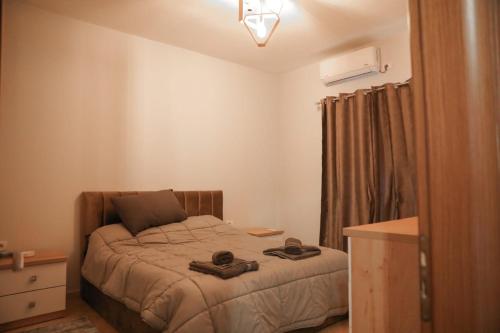 Postel nebo postele na pokoji v ubytování Burimi House