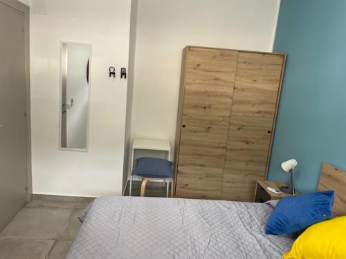 a bedroom with a bed and a large wooden door at Cori di Capreria in Marina di Palma