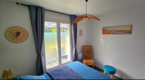 Postel nebo postele na pokoji v ubytování EntreLac&Océan3 - entrée et terrasse privée