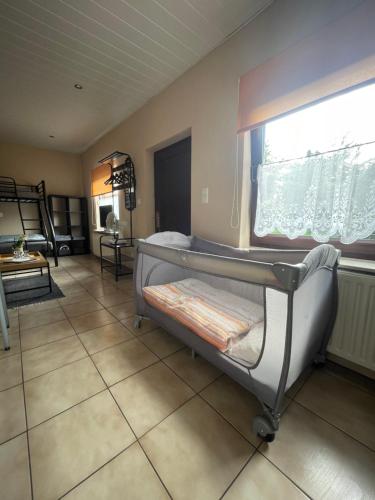a hospital room with a bed and a window at Eleni in Bad Bramstedt