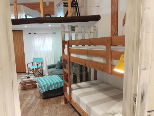 Μία ή περισσότερες κουκέτες σε δωμάτιο στο Casa Monreal