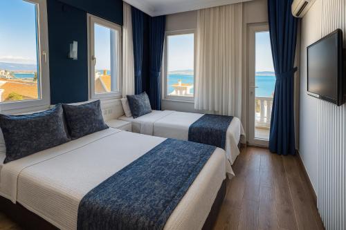 Giường trong phòng chung tại Ezer Hotel