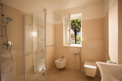 Ванная комната в Holiday Apartments - Camping Al Porto
