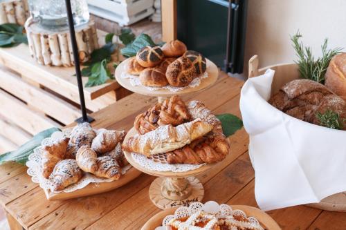 a table with three plates of different types of pastries at Villa Giulia Relais & Spa in Jesolo