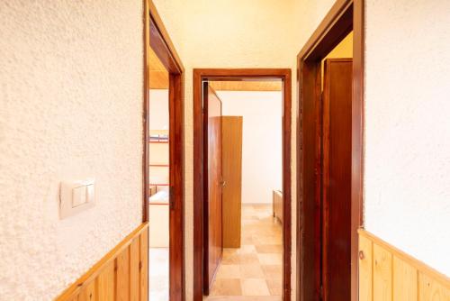 a hallway with two doors leading into a room at Dimora PietrAnna - Paradiso in Sardegna in Li Valcaggi