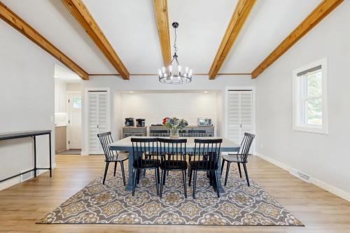a dining room with a table and chairs at Lodi Lakehouse in Lodi
