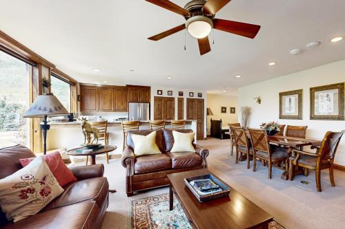 a living room with a couch and a dining room at Vail Spa 301 in Vail