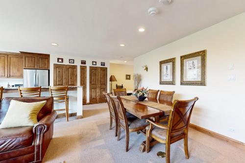 a kitchen and dining room with a table and chairs at Vail Spa 301 in Vail