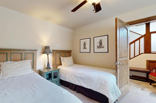 a bedroom with two beds and a window at Vail Spa 301 in Vail
