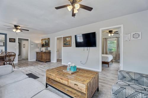 a living room with a couch and a tv at 3BR Home 4 mins St Anthony, Sleeps 6 #14A in Oklahoma City