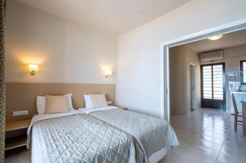 a bedroom with a large bed in a room at ELIXIA in Tolo