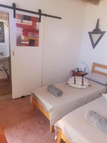 a room with two twin beds in a room at Ksar Montana Hôtel, Chambres piscine in Taforhalt