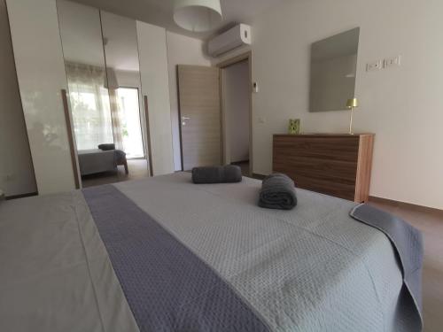 a bedroom with a large bed with two pillows on it at La Bianca Dimora in Sulmona