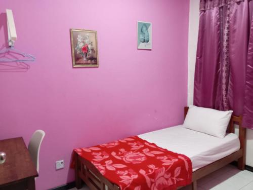 Ένα ή περισσότερα κρεβάτια σε δωμάτιο στο CAMELIA HOLIDAY APARTMENT