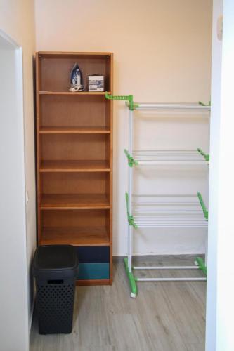 a closet with shelves and a trash can at Cozy 2 BDR Apartment Near Murdeira Beach LCGR in Palha Verde