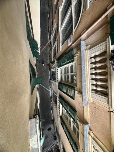 an alleyway between two buildings in a city at Genova Antica in Genova