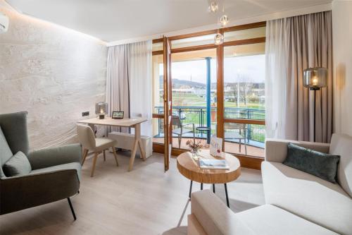 a hotel room with a view of a balcony at Best Western Plus Kurhotel an der Obermaintherme in Bad Staffelstein