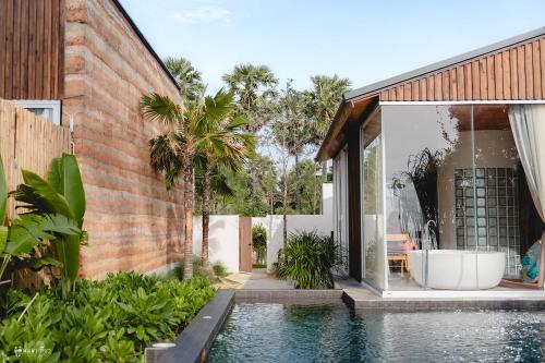 Bazén v ubytování Furusato Shack Pranburi ฟูรุซาโตะ แชค ปราณบุรี ふるさとシャック nebo v jeho okolí