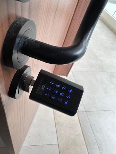 a remote control is attached to a desk drawer at Appartement moderne avec piscine, 2 chambres in Bouznika