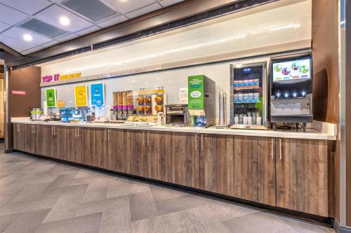 a food counter at a store in a mall at Tru By Hilton The Colony in The Colony