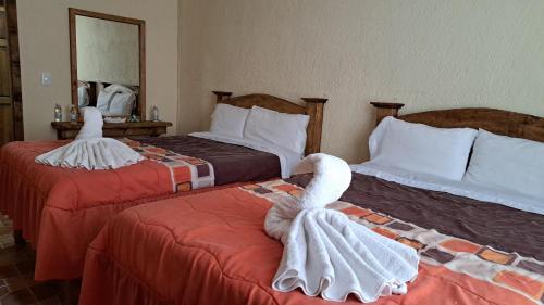 Hotel Renacerにあるベッド