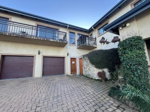 a house with two garage doors and a brick driveway at Geust House 4288 in Bethlehem