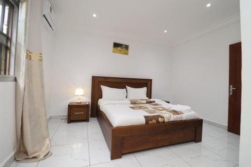 Una cama o camas en una habitación de AfriqPnB VC Appart avec Piscine