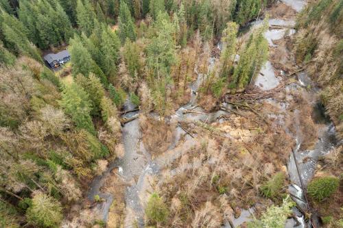 an aerial view of a river in a forest at Updated Large River Front Home With Hot Tub in McKenzie Bridge
