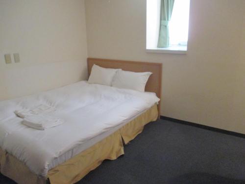 Katil atau katil-katil dalam bilik di Hotel Green Well