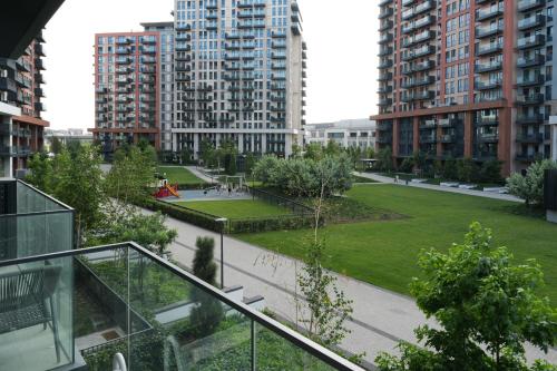 a view of a park in a city with tall buildings at Scala Reale in Sajmište