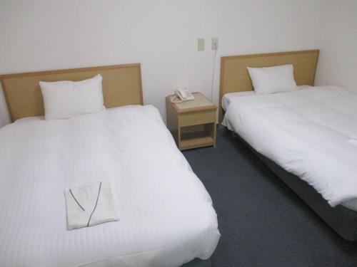 Katil atau katil-katil dalam bilik di Hotel Green Well