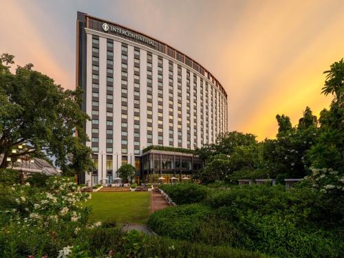 a large building with a rainbow in the sky at InterContinental Chiang Mai The Mae Ping in Chiang Mai