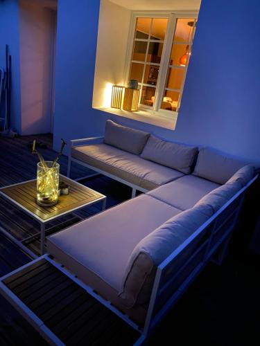 a living room with a couch and a table at Baionako extea in Bayonne