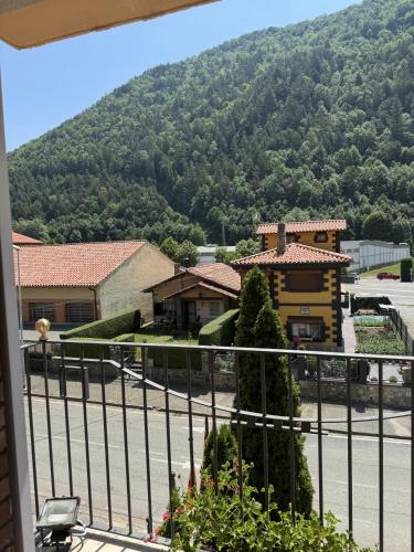 a view of a house with a mountain in the background at Hotel Edelweiss in Camprodon