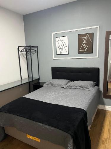 a bedroom with a large bed in a room at flat Luiz Carlos Mouzinho in Teresina