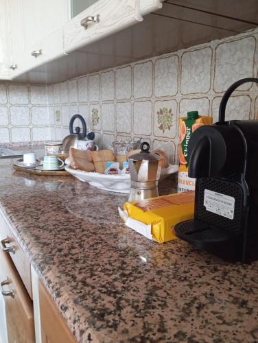 a kitchen counter with a sink and a counter top with a counter sidx sidx at Nonna Anita in Castelveccana