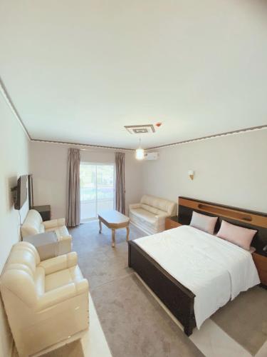 Postel nebo postele na pokoji v ubytování Hotel Tanger Room