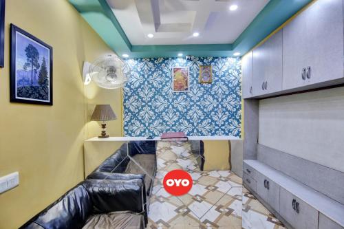 a room with a couch with a no sign on it at Hotel O Prime Stay in New Delhi